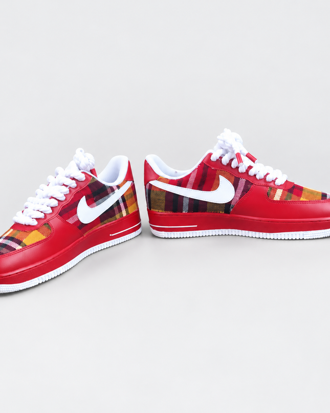 Red plaid custom sneakers on a light gray studio background