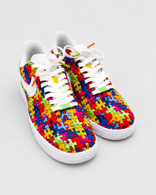 Puzzle pattern custom sneakers on a light gray studio background